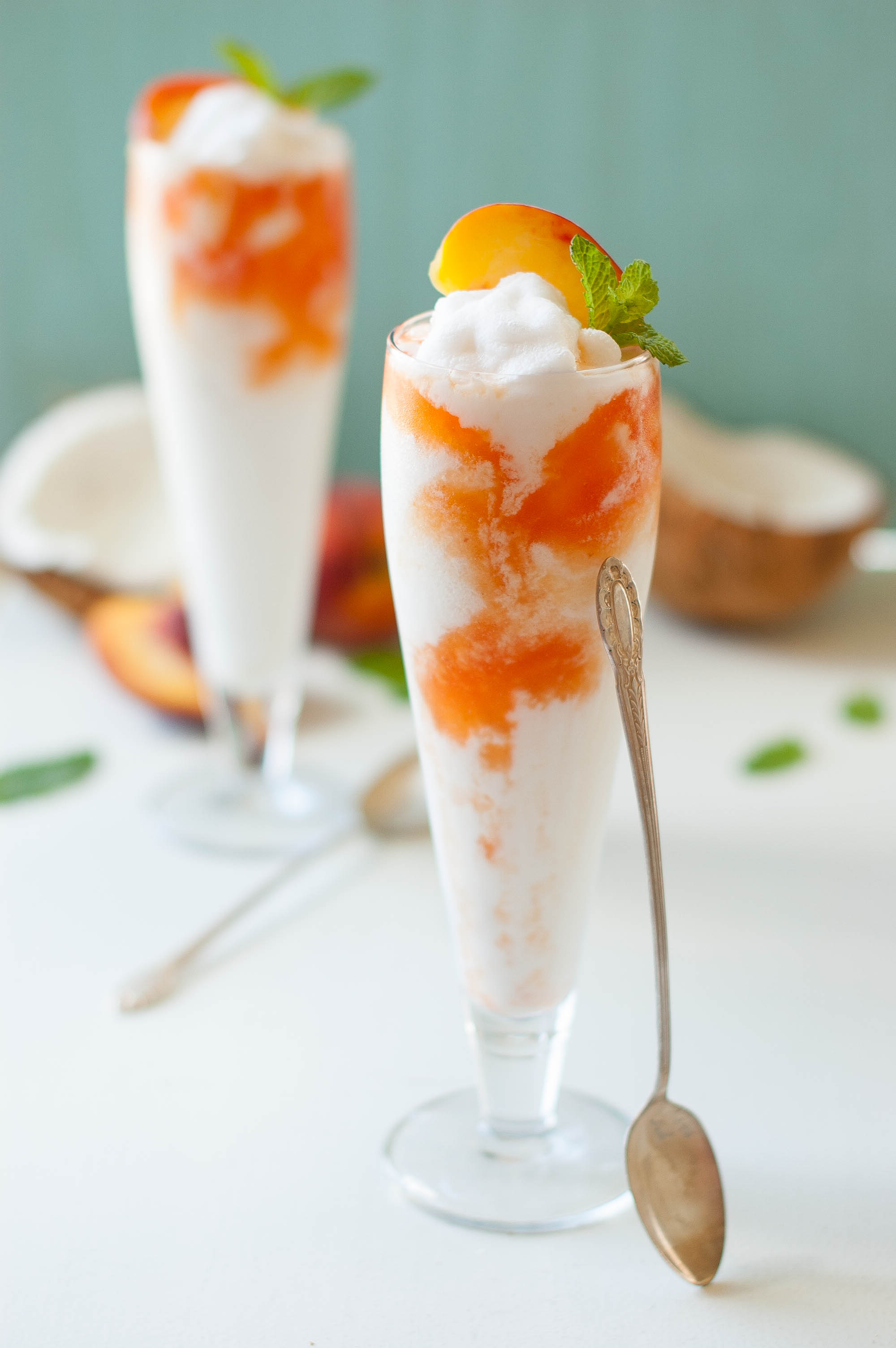 https://www.thekitchenmccabe.com/wp-content/uploads/2014/06/Coconut-Peach-Lemonade-Slushies-2.jpg